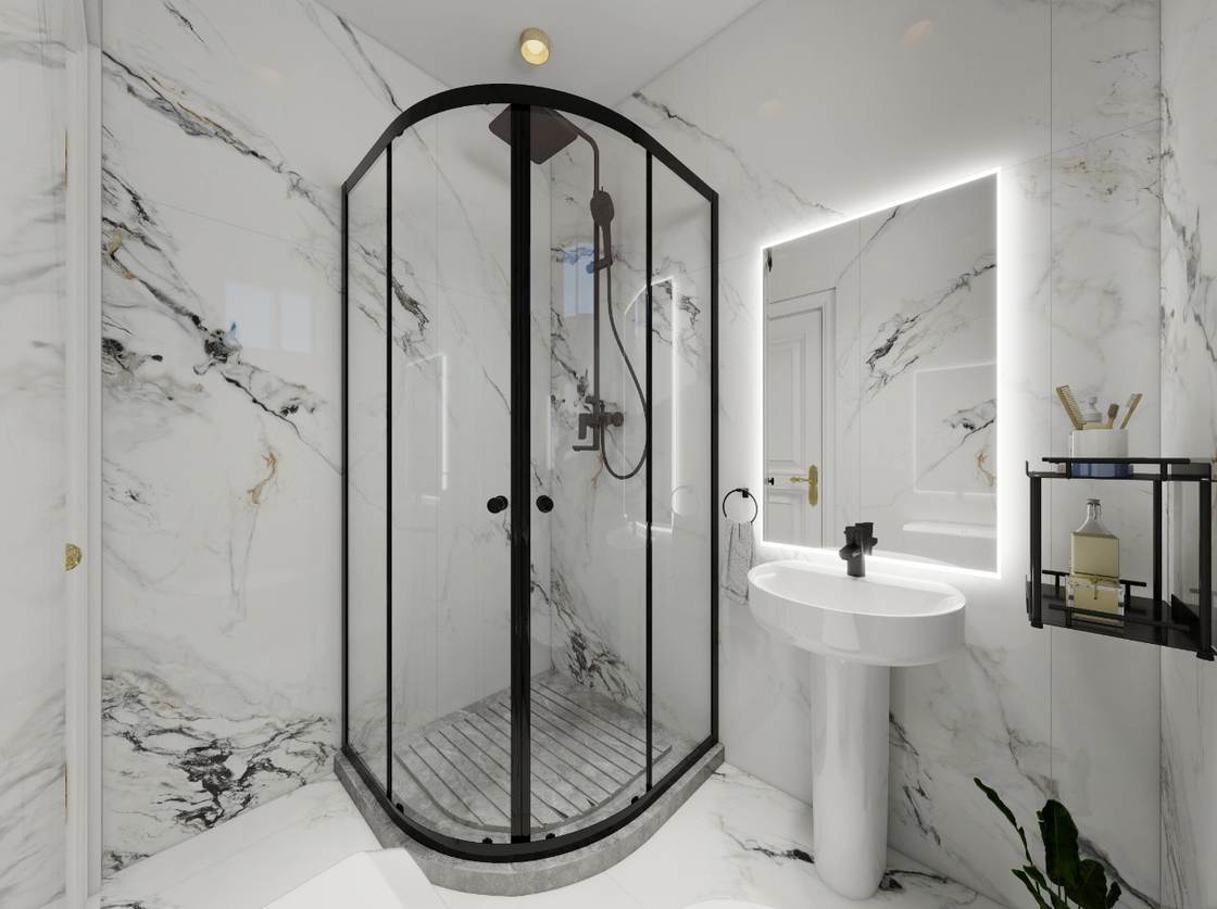 Compact bathroom design with white marble walls, curved black-framed shower and backlit mirror